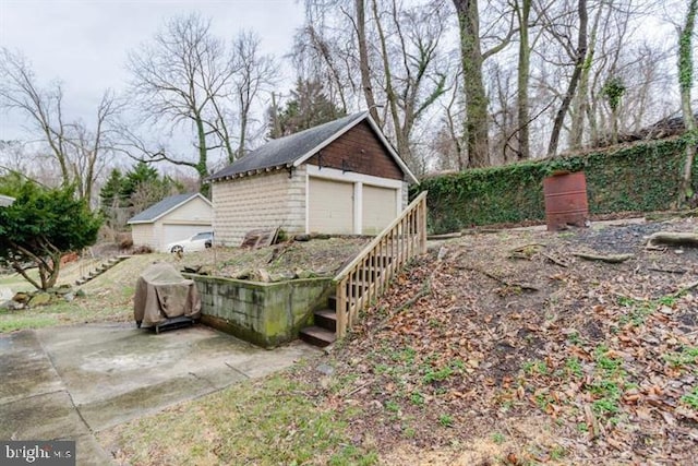 2306 Monticello Rd, Baltimore, MD 21216 - view of property exterior with a detached garage and an outdoor structure