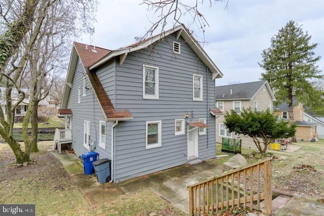 2306 Monticello Rd, Baltimore, MD 21216 - rear view of house with a patio