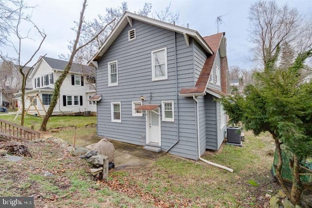 2306 Monticello Rd, Baltimore, MD 21216 - rear view of property with cooling unit
