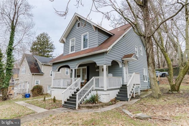 2306 Monticello Rd, Baltimore, MD 21216 - bungalow-style house with a porch and stairway