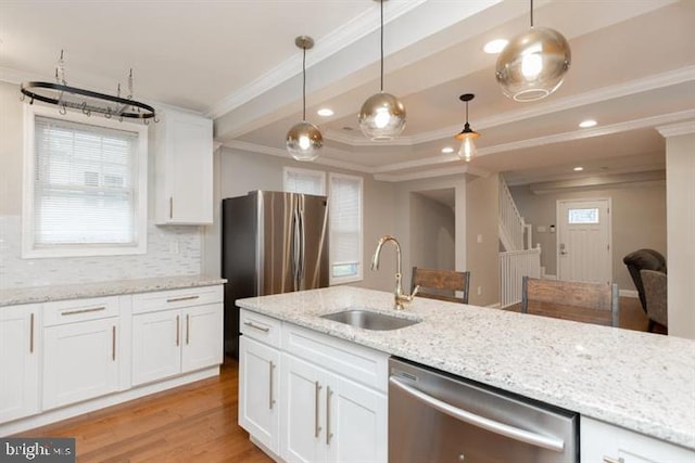 2306 Monticello Rd, Baltimore, MD 21216 - kitchen with appliances with stainless steel finishes, a sink, ornamental molding, tasteful backsplash, and white cabinetry