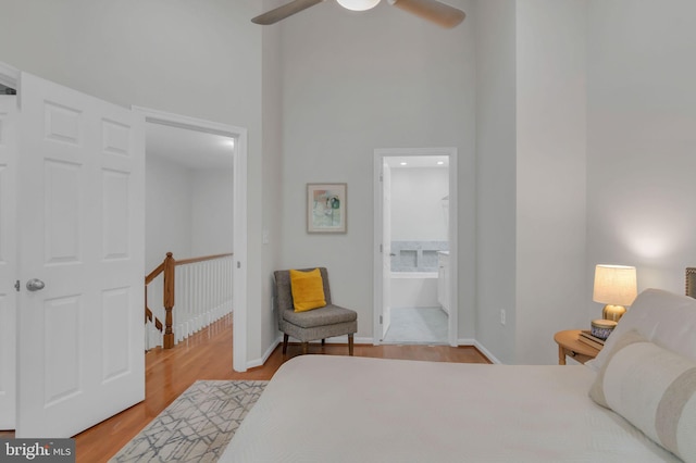 1122 S Monroe St, Arlington, VA 22204 - bedroom with wood finished floors, a high ceiling, ensuite bathroom, and a ceiling fan