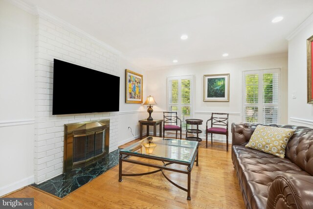 10104 Colebrook Ave, Potomac, MD 20854 - living room with a brick fireplace, crown molding, healthy amount of natural light, wood finished floors, and recessed lighting