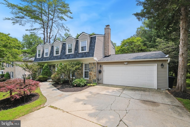 10104 Colebrook Ave, Potomac, MD 20854 - view of front of home with a chimney, concrete driveway, a garage, and stone siding