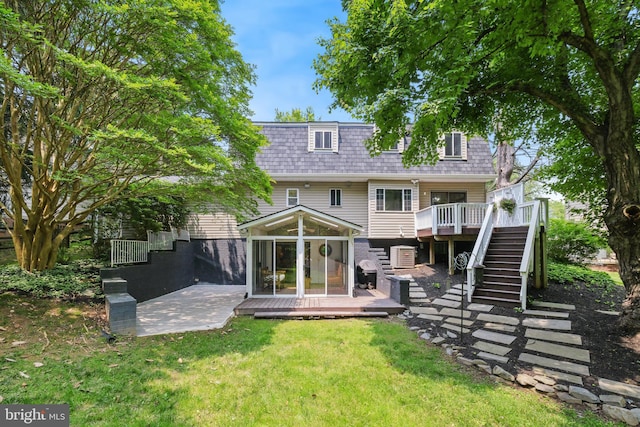 10104 Colebrook Ave, Potomac, MD 20854 - back of property featuring stairway, a deck, a lawn, a patio, and central AC