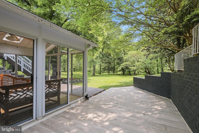 10104 Colebrook Ave, Potomac, MD 20854 - deck featuring a sunroom, stairway, a yard, and view of scattered trees