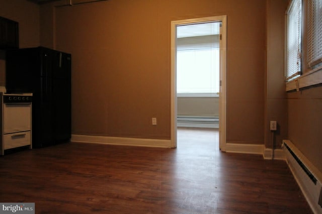 4623 N Broad St, Philadelphia, PA 19140 - kitchen with baseboard heating, dark wood finished floors, freestanding refrigerator, and baseboards
