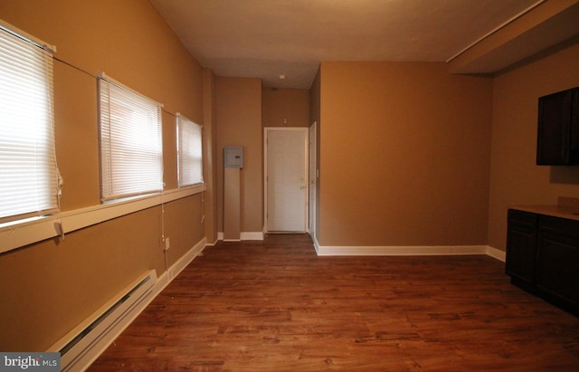 4623 N Broad St, Philadelphia, PA 19140 - unfurnished living room with a baseboard radiator, dark wood-style floors, and baseboards
