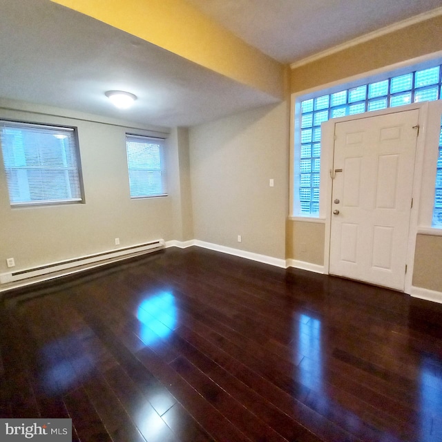 4623 N Broad St, Philadelphia, PA 19140 - entrance foyer featuring a baseboard heating unit, wood finished floors, and baseboards