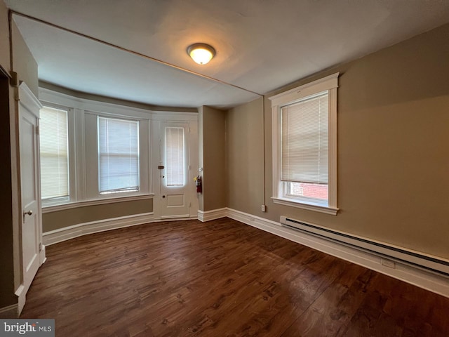 4623 N Broad St, Philadelphia, PA 19140 - entrance foyer featuring baseboard heating, dark wood-style flooring, and baseboards