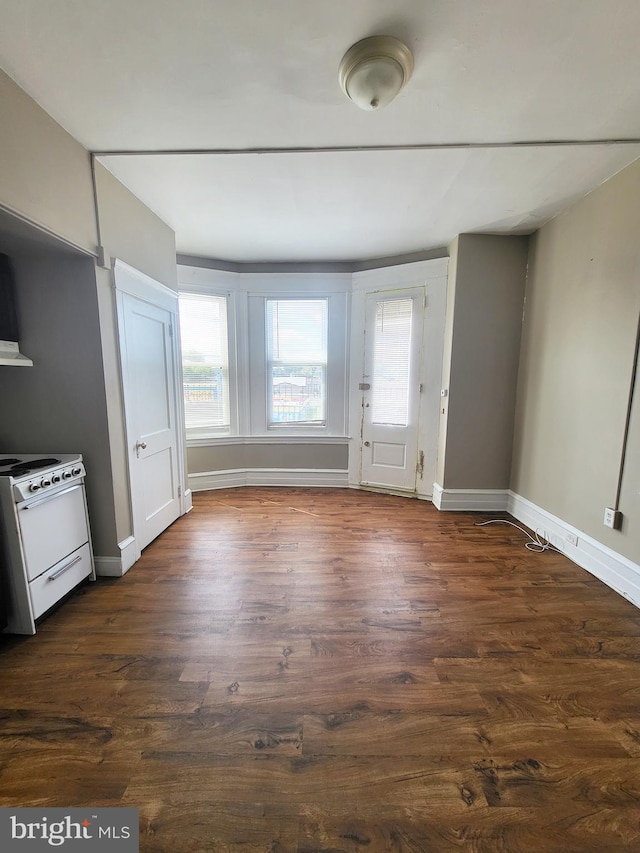4623 N Broad St, Philadelphia, PA 19140 - unfurnished dining area with plenty of natural light, dark wood-style floors, and baseboards