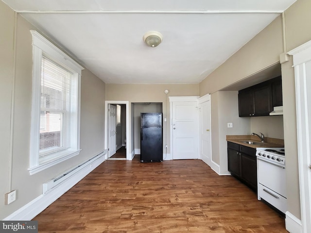 4623 N Broad St, Philadelphia, PA 19140 - kitchen featuring freestanding refrigerator, white electric range oven, wood finished floors, a sink, and dark cabinetry