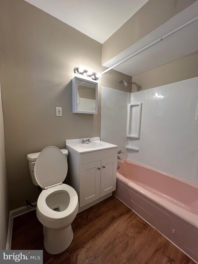 4623 N Broad St, Philadelphia, PA 19140 - bathroom with wood finished floors, toilet, washtub / shower combination, and vanity