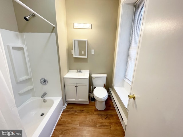 4623 N Broad St, Philadelphia, PA 19140 - full bathroom with a baseboard heating unit, toilet, wood finished floors, vanity, and shower / washtub combination