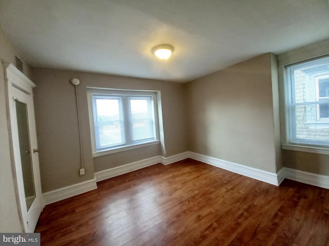 4623 N Broad St, Philadelphia, PA 19140 - spare room with wood finished floors and baseboards