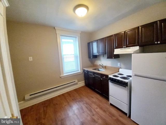 4623 N Broad St, Philadelphia, PA 19140 - kitchen with white appliances, a sink, a baseboard radiator, under cabinet range hood, and wood finished floors