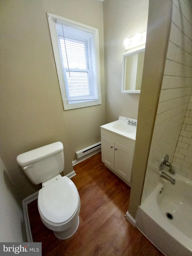 4623 N Broad St, Philadelphia, PA 19140 - full bath featuring a baseboard radiator, vanity, toilet, wood finished floors, and bathing tub / shower combination