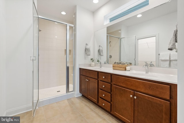 118 Milkweed Dr, Lake Frederick, VA 22630 - bathroom with a shower stall, tile patterned flooring, double vanity, recessed lighting, and a spacious closet