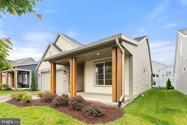 118 Milkweed Dr, Lake Frederick, VA 22630 - view of front of house with covered porch, an attached garage, a front yard, and stone siding