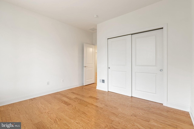 118 Milkweed Dr, Lake Frederick, VA 22630 - unfurnished bedroom featuring light wood finished floors, baseboards, and a closet
