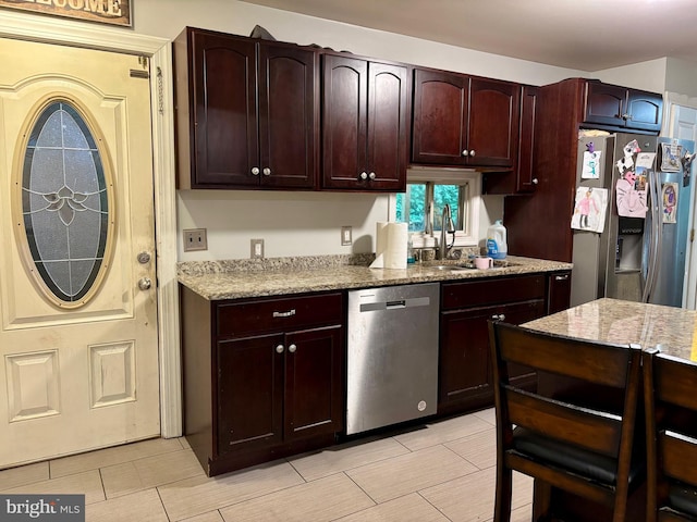 149 Smoketown Rd, Mertztown, PA 19539 - kitchen with stainless steel appliances, a sink, light stone counters, and light tile patterned flooring