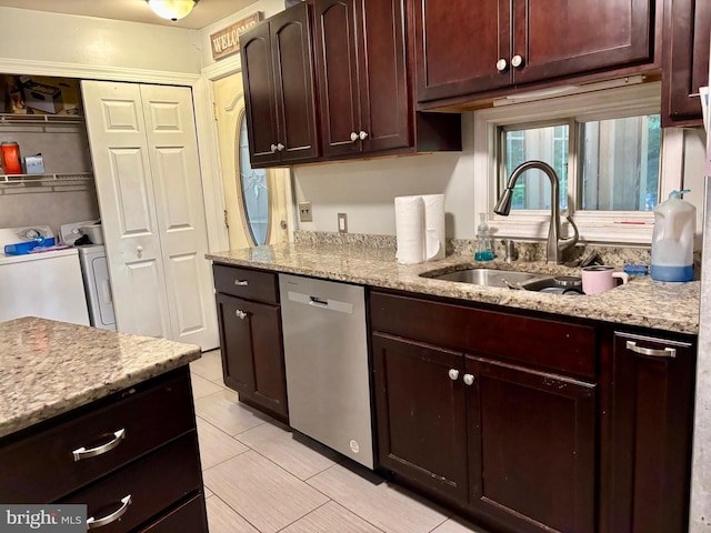 149 Smoketown Rd, Mertztown, PA 19539 - kitchen with stainless steel dishwasher, washing machine and dryer, a sink, light tile patterned flooring, and light stone countertops