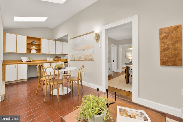 1505 Otis St NE, Washington, DC 20017 - dining space featuring lofted ceiling, a skylight, and baseboards