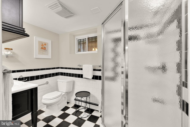 1505 Otis St NE, Washington, DC 20017 - full bathroom with a baseboard radiator, tile patterned floors, a stall shower, toilet, and a wainscoted wall