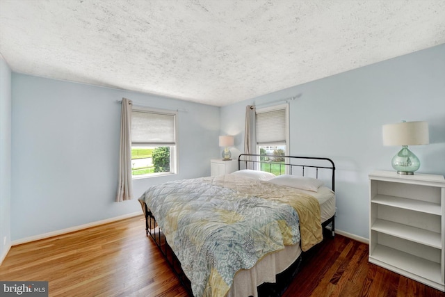 4220 E Joppa Rd, Nottingham, MD 21236 - bedroom with wood finished floors, a textured ceiling, and baseboards