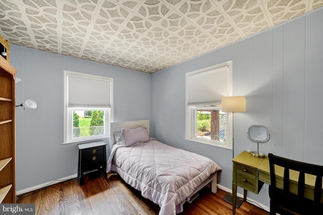 4220 E Joppa Rd, Nottingham, MD 21236 - bedroom with multiple windows, an ornate ceiling, wood finished floors, and baseboards
