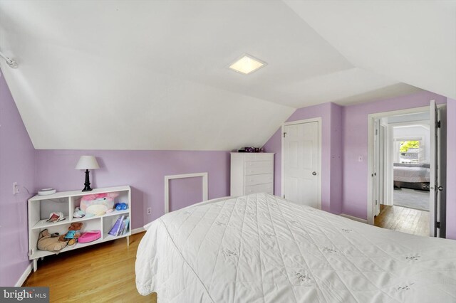 4220 E Joppa Rd, Nottingham, MD 21236 - bedroom with lofted ceiling, wood finished floors, and baseboards