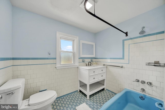 4220 E Joppa Rd, Nottingham, MD 21236 - bathroom featuring tile walls, toilet, vanity, wainscoting, and tile patterned flooring