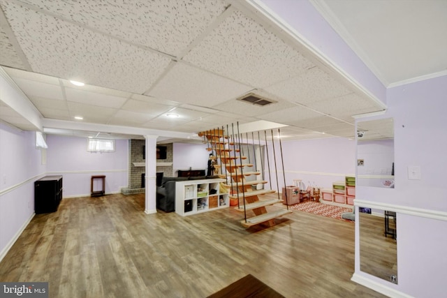 4220 E Joppa Rd, Nottingham, MD 21236 - recreation room with wood finished floors, a paneled ceiling, a fireplace, and baseboards