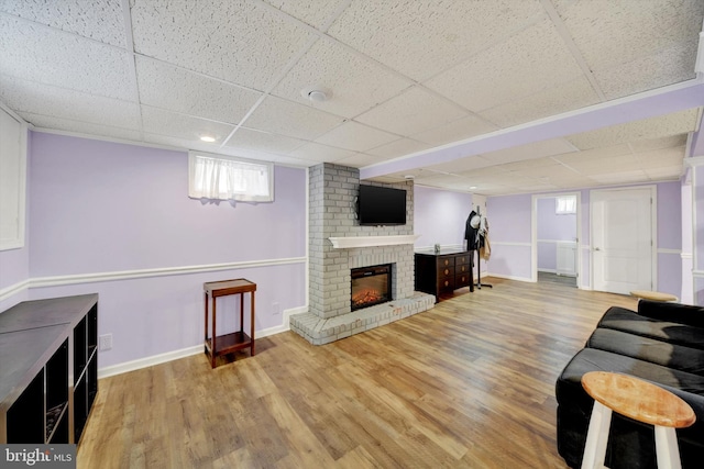 4220 E Joppa Rd, Nottingham, MD 21236 - living area with a paneled ceiling, a fireplace, wood finished floors, and baseboards