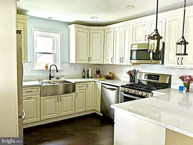 4220 E Joppa Rd, Nottingham, MD 21236 - kitchen featuring stainless steel appliances, a sink, hanging light fixtures, backsplash, and recessed lighting