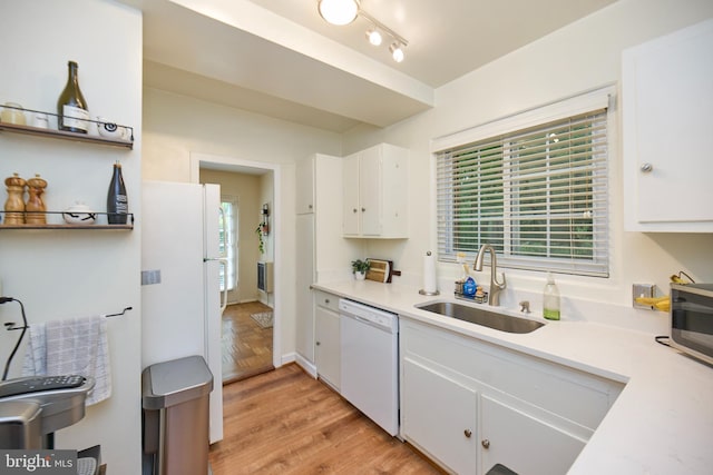 3501 Martha Custis Dr, Alexandria, VA 22302 - kitchen with white appliances, a sink, white cabinetry, light countertops, and light wood-style flooring