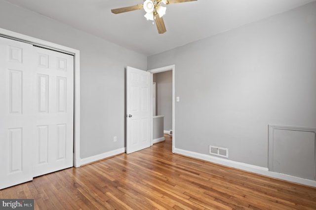 4937 Schaub Ave, Baltimore, MD 21206 - unfurnished bedroom with baseboards, wood finished floors, a closet, and ceiling fan