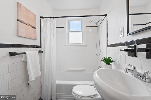 4937 Schaub Ave, Baltimore, MD 21206 - full bathroom with tile walls, a sink, toilet, shower / bath combo, and wainscoting