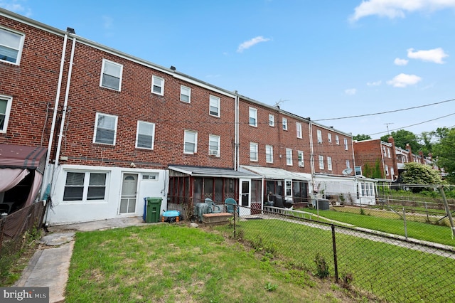 4937 Schaub Ave, Baltimore, MD 21206 - rear view of property featuring a sunroom and central AC unit