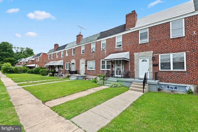 4937 Schaub Ave, Baltimore, MD 21206 - multi unit property with a chimney, brick siding, a front lawn, and a residential view