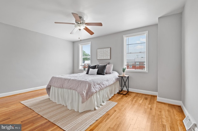 4937 Schaub Ave, Baltimore, MD 21206 - bedroom with baseboards, light wood finished floors, and a ceiling fan
