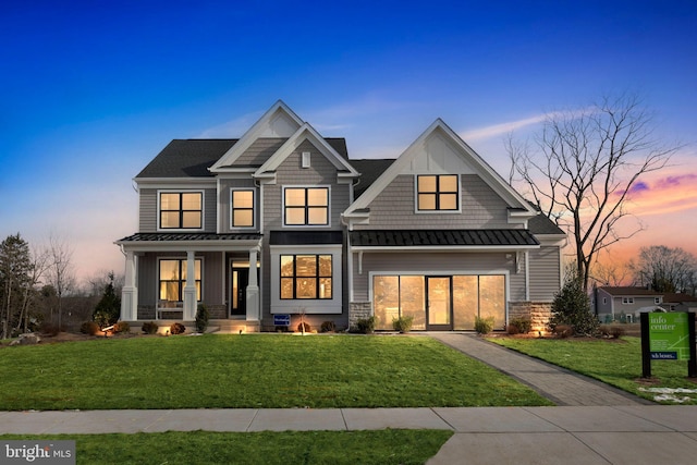 4389 Taviston Ct E, Emmaus, PA 18049 - view of front of house with covered porch, a standing seam roof, a lawn, and metal roof