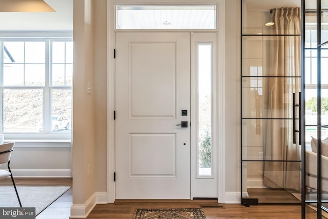 4389 Taviston Ct E, Emmaus, PA 18049 - foyer with wood finished floors, baseboards, and healthy amount of natural light