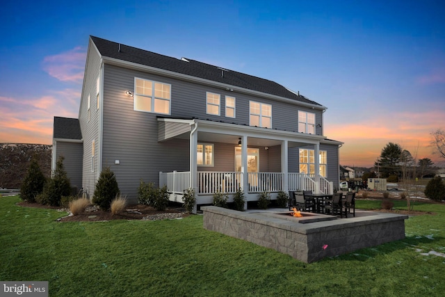 4389 Taviston Ct E, Emmaus, PA 18049 - back of house at dusk with a yard, a fire pit, and a patio area