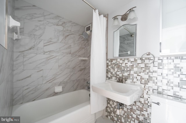 4200 Cathedral Ave NW Unit 615, Washington, DC 20016 - bathroom featuring shower / tub combo and tasteful backsplash