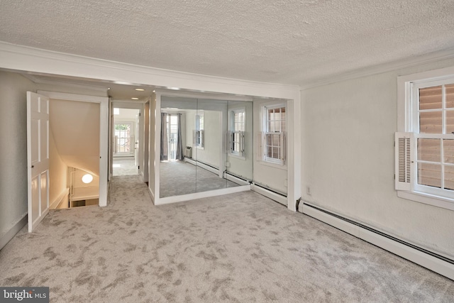 38 W Ferry St, New Hope, PA 18938 - carpeted spare room featuring crown molding, a baseboard radiator, a textured ceiling, and baseboards