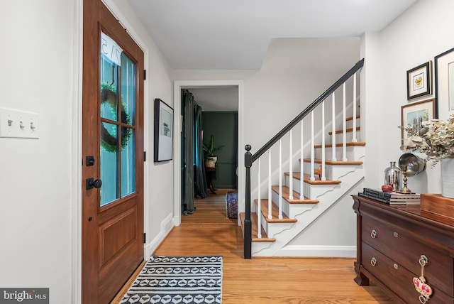 715 Morningside Dr, Towson, MD 21204 - entryway featuring wood finished floors, stairway, and baseboards