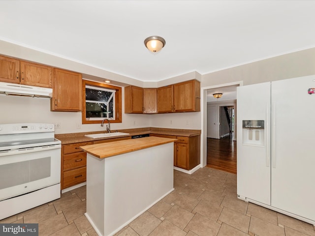 21 E D St, Brunswick, MD 21716 - kitchen with white appliances, under cabinet range hood, a sink, butcher block countertops, and a kitchen island