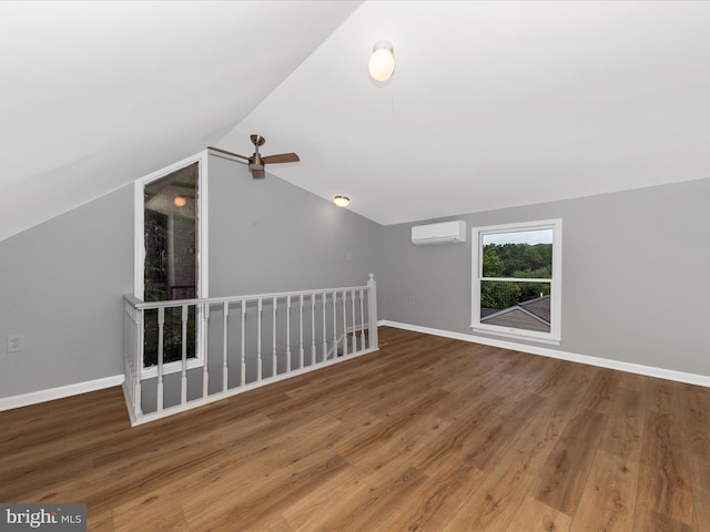 21 E D St, Brunswick, MD 21716 - additional living space with a wall unit AC, vaulted ceiling, wood finished floors, baseboards, and ceiling fan