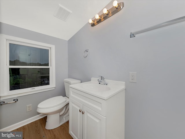 21 E D St, Brunswick, MD 21716 - bathroom with toilet, wood finished floors, vanity, vaulted ceiling, and baseboards